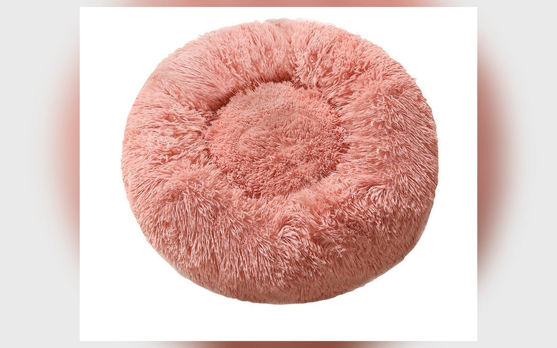 Round fluffy dog bed in pink